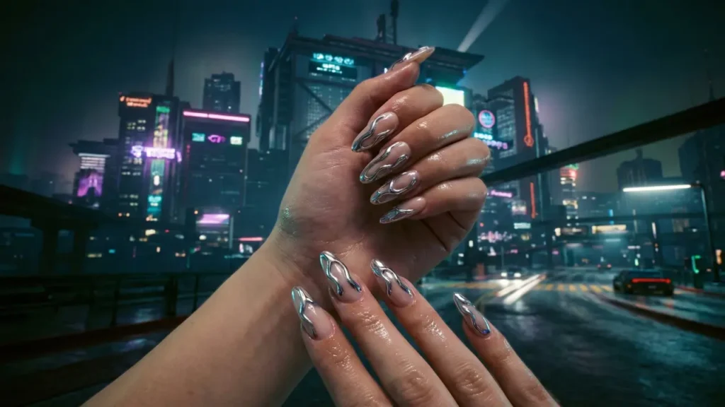 Molten chrome nails trend 2026 featuring 3D silver drips.