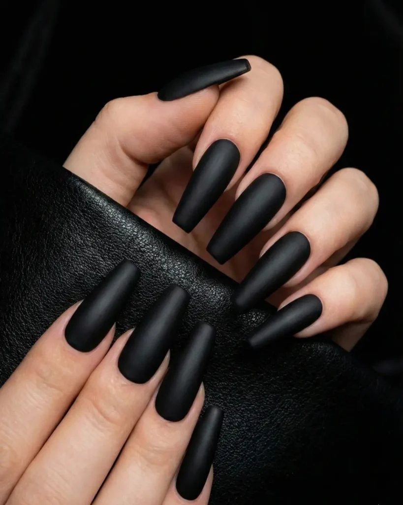  Long matte black coffin shaped nails, featuring tapered sides and a flat squared-off tip.