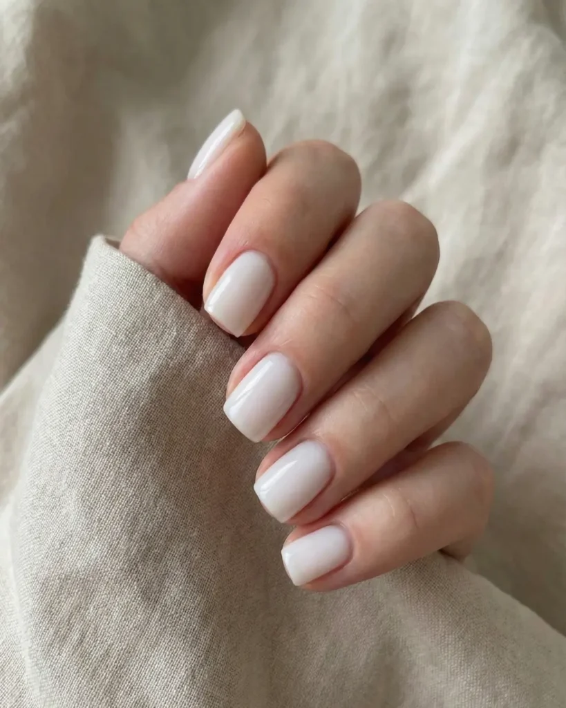 Milky white "Soap Nails" featuring the immaculate cuticle work of a Russian Manicure.