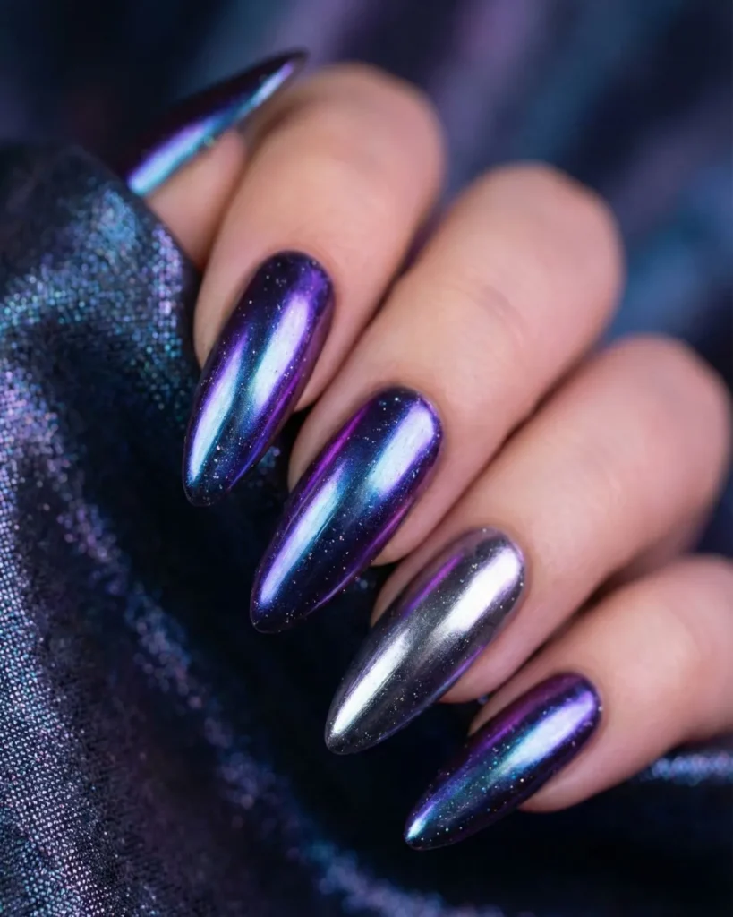 Extra Celestial chrome nails with a shifting iridescent finish looking like oil slick or moon dust.