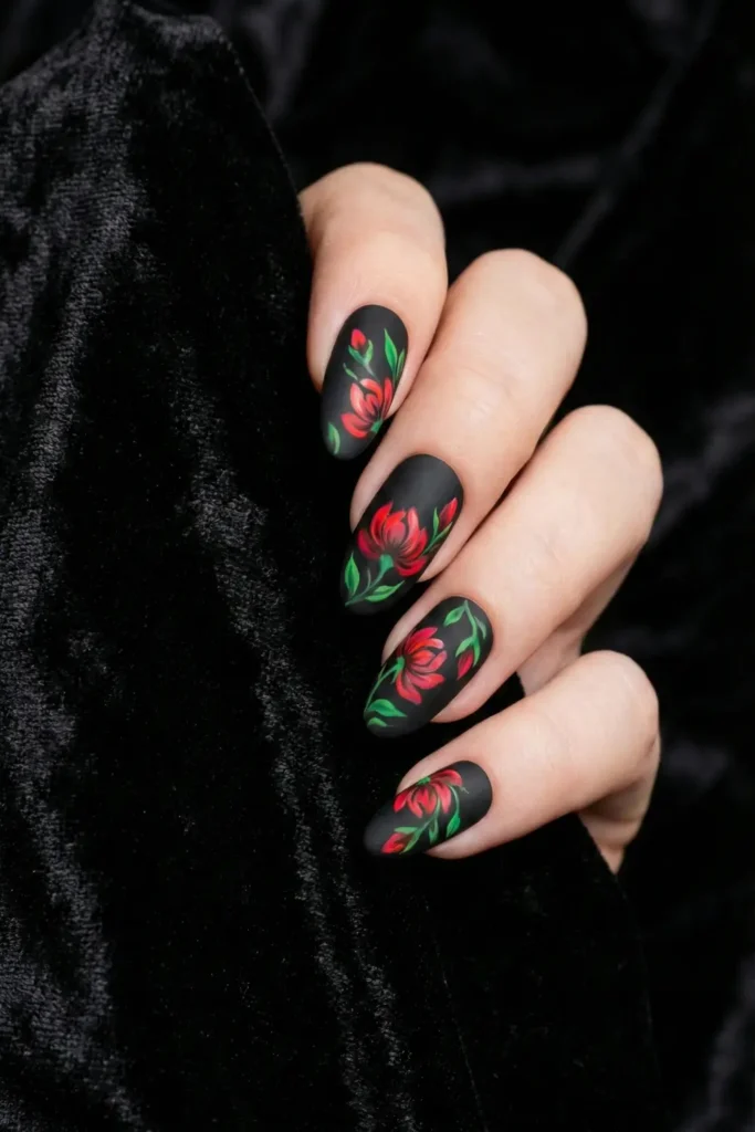Dark floral flower nail art on black matte background.